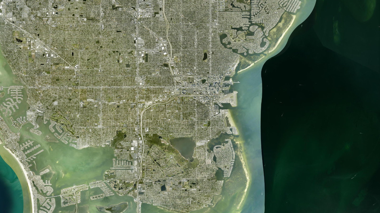 True overhead satellite view of St. Petersburg, Florida, showing downtown, waterfront neighborhoods and Tampa Bay