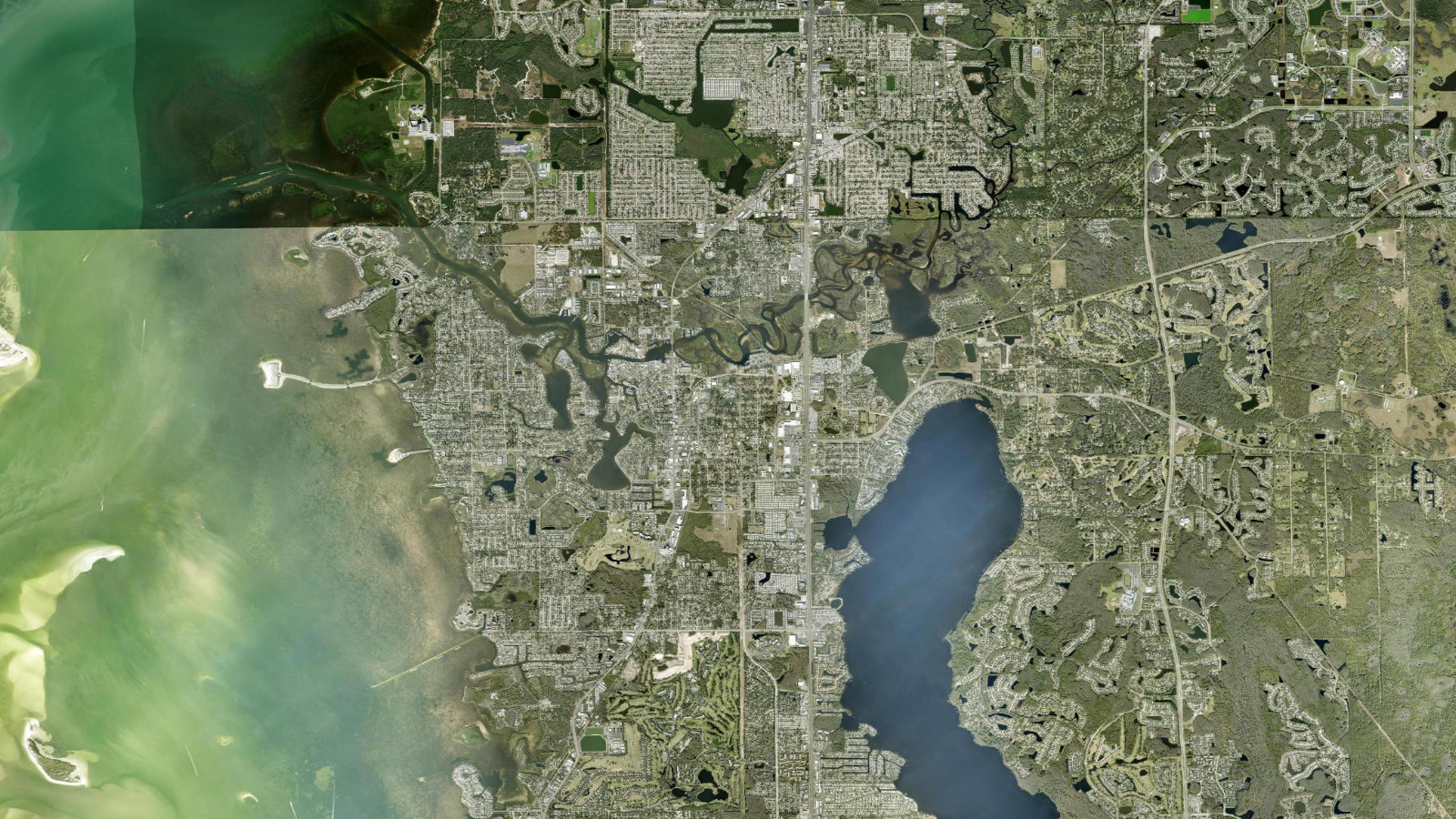 True overhead satellite view of Tarpon Springs, Florida, showing the Anclote River, bayous and Gulf coastline